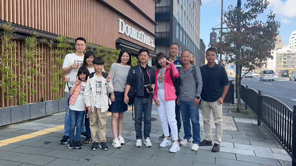 A family group outside their hotel entrance in Kyoto